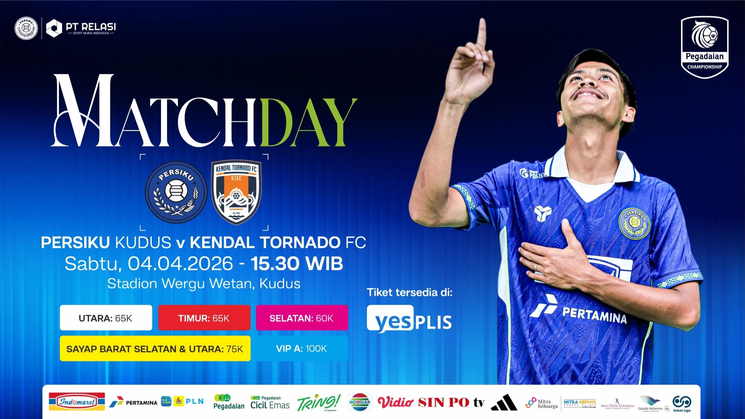 Stadium packed with fans holding blue scarves during a night match